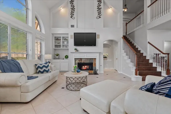 a kitchen with stainless steel appliances granite countertop a sink stove and microwave