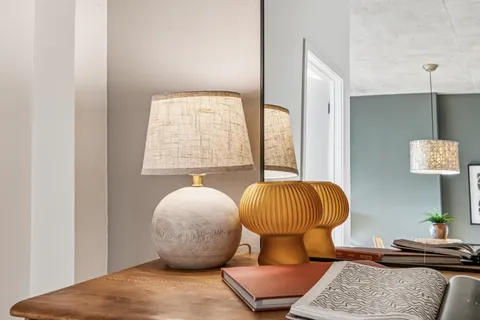 a bedroom with furniture and a window