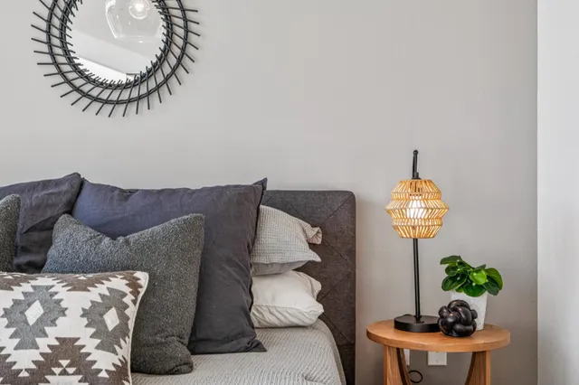 a living room with a couch and a chandelier