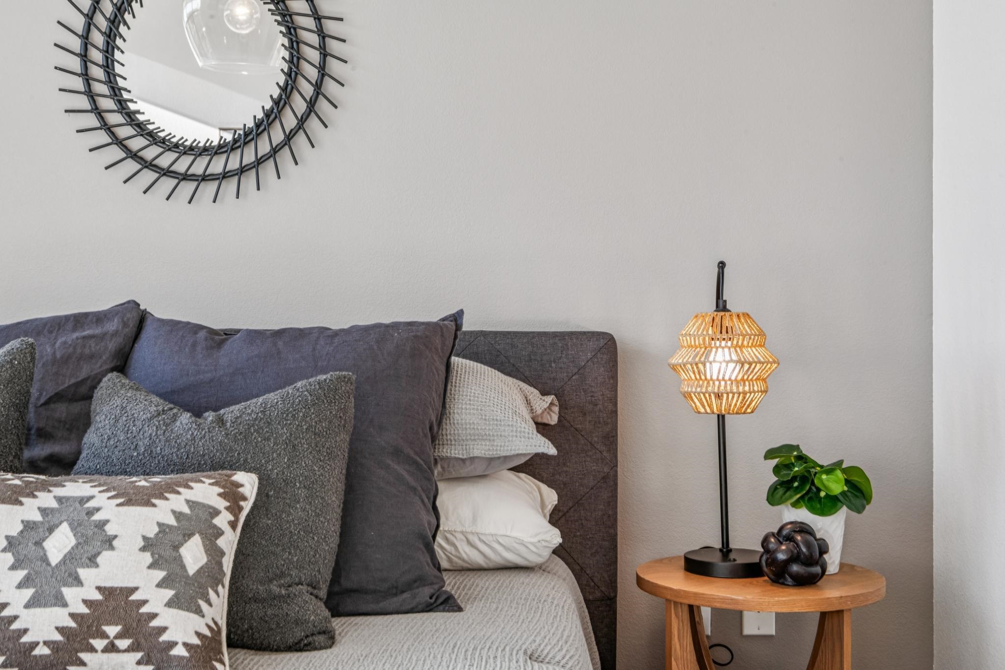 288 3rd Street, Unit 406 Oakland, CA 94607 - Photo 20 of 32 a living room with a couch and a chandelier