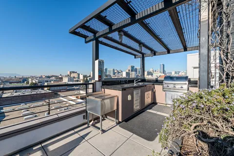 a open kitchen with a sink and cabinets