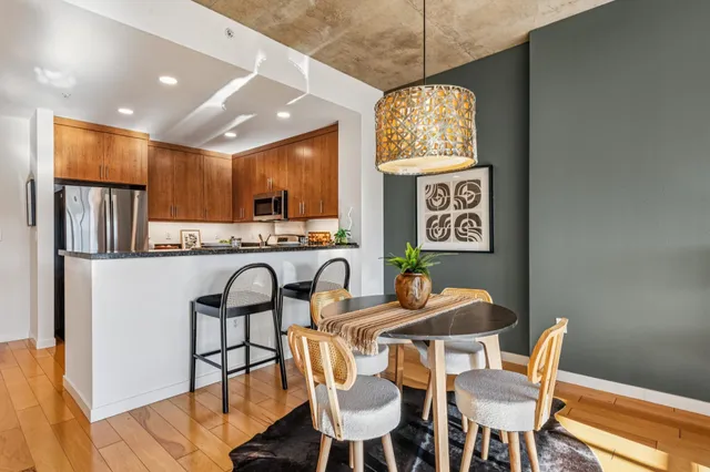 a view of a dining room with furniture window and wooden floor