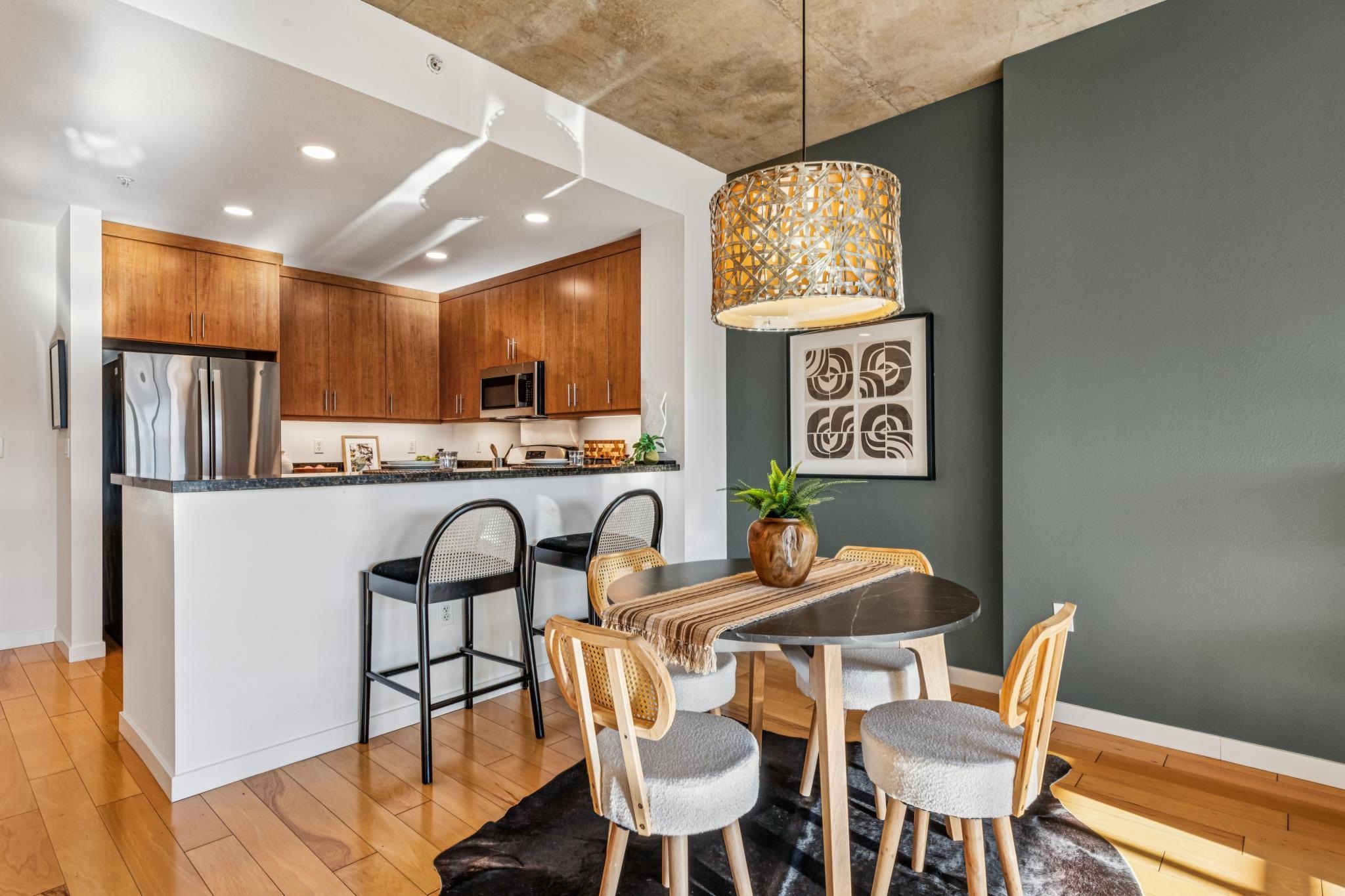 288 3rd Street, Unit 406 Oakland, CA 94607 - Photo 3 of 32 a view of a dining room with furniture window and wooden floor