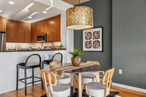 a dining room with furniture and window