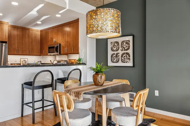 a dining room with furniture and window