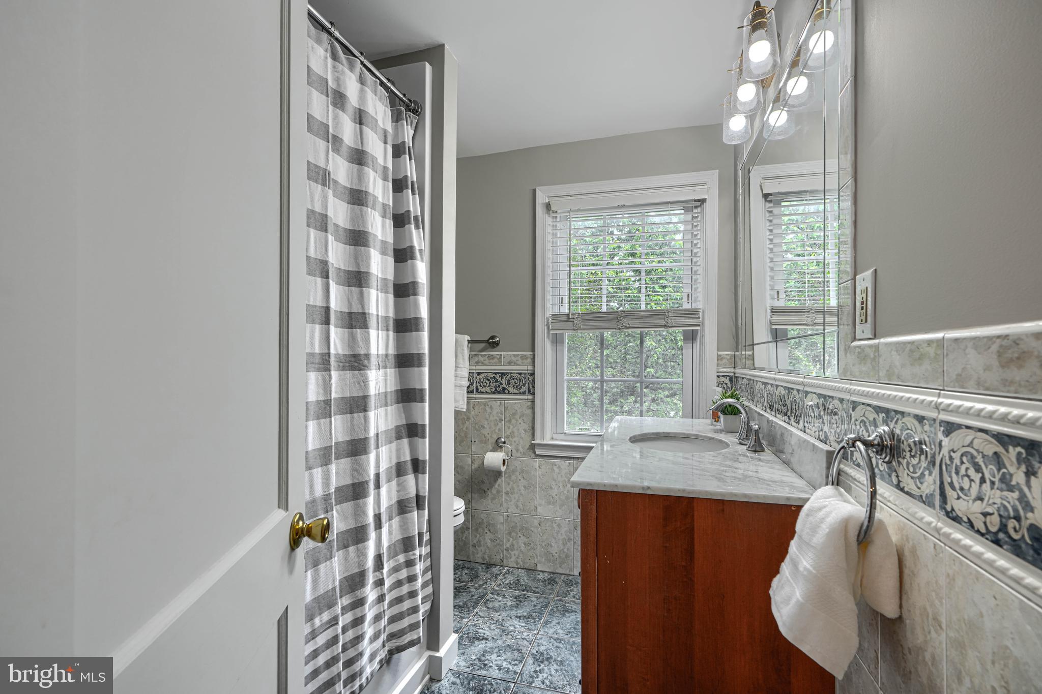 8132 Pleasant Plains Road Towson, MD 21286 - Photo 29 of 55 a bath room with a bath tub and shower