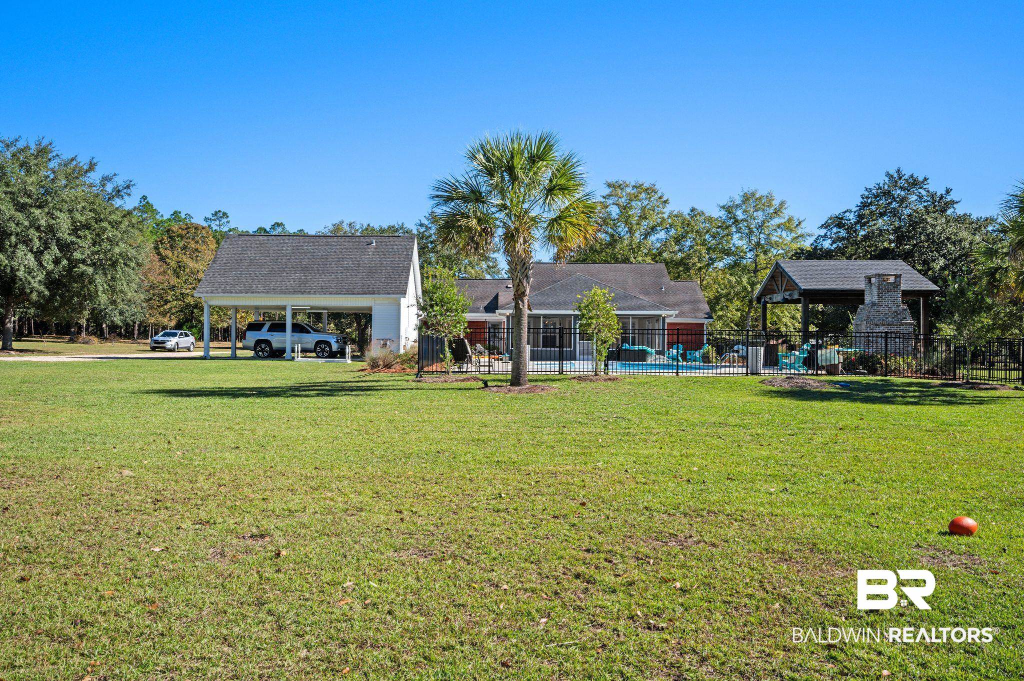 38211-d) V R Byrd Road Bay Minette, AL 36507 - Photo 41 of 58 View of yard with a carport and a swimming pool