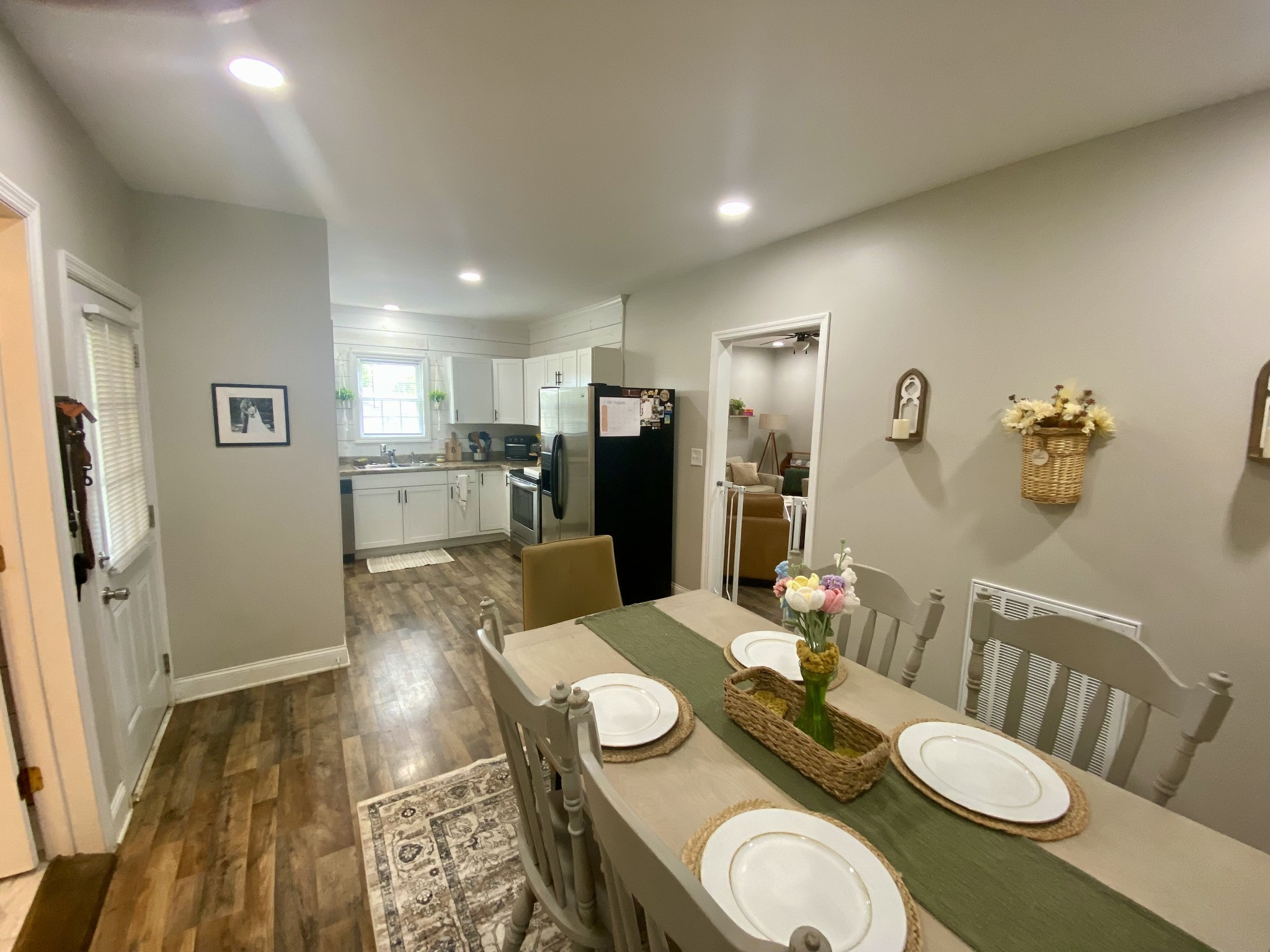 308 Spring Street Loretto, TN 38469 - Photo 17 of 28 a dining room with furniture and a wooden floor