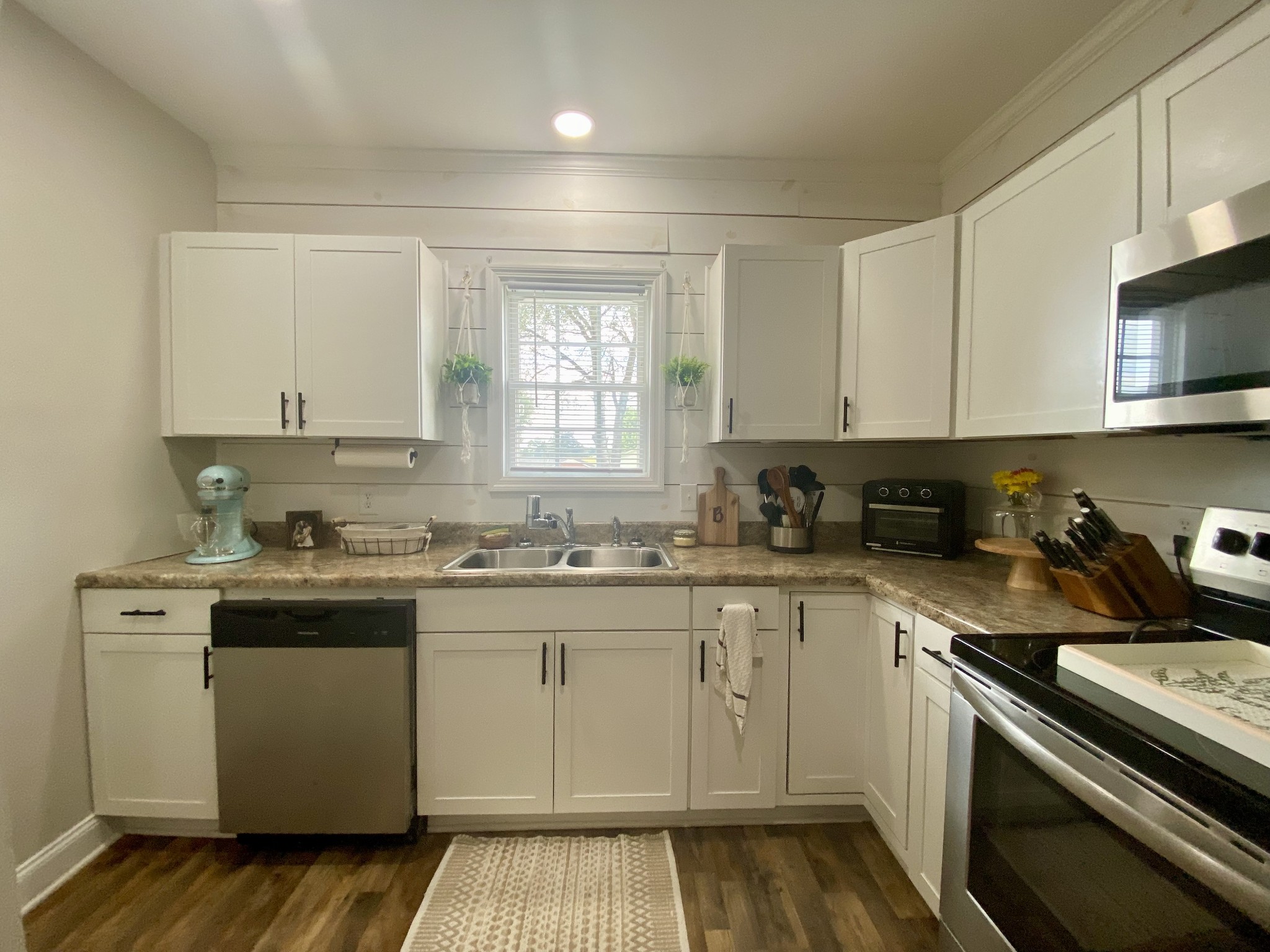 308 Spring Street Loretto, TN 38469 - Photo 20 of 28 a kitchen with a sink stove top oven and cabinets