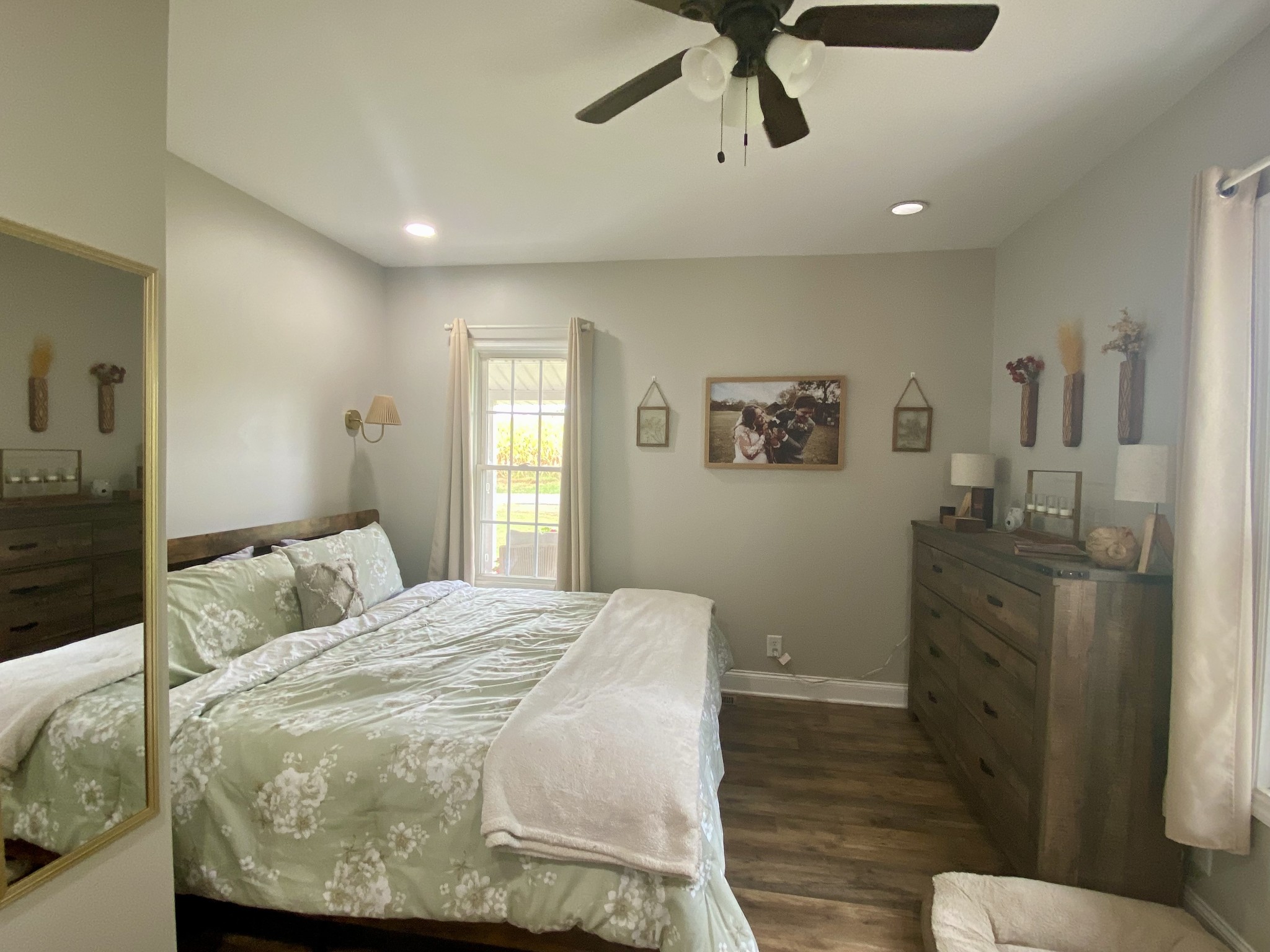 308 Spring Street Loretto, TN 38469 - Photo 24 of 28 a bedroom with a bed and wooden floor