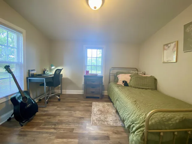 a bathroom with a sink a mirror and a shower