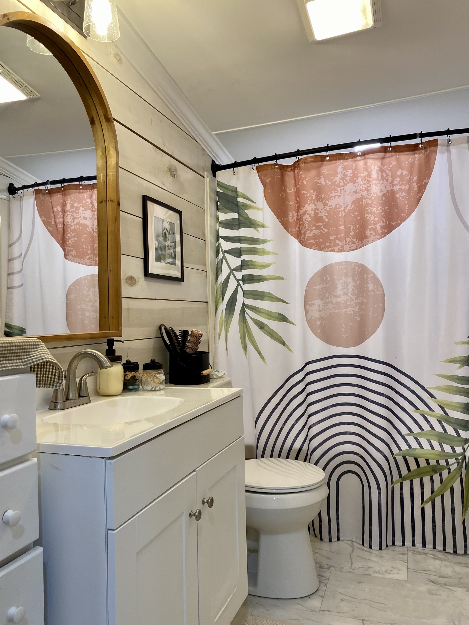 308 Spring Street Loretto, TN 38469 - Photo 27 of 28 a bathroom with a sink a mirror and a shower