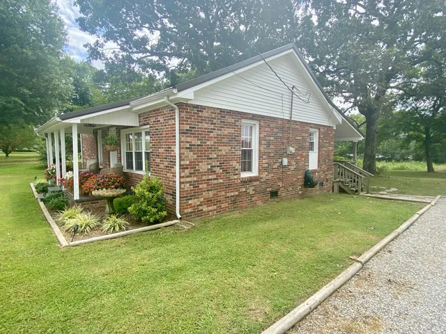 a front view of house with garden