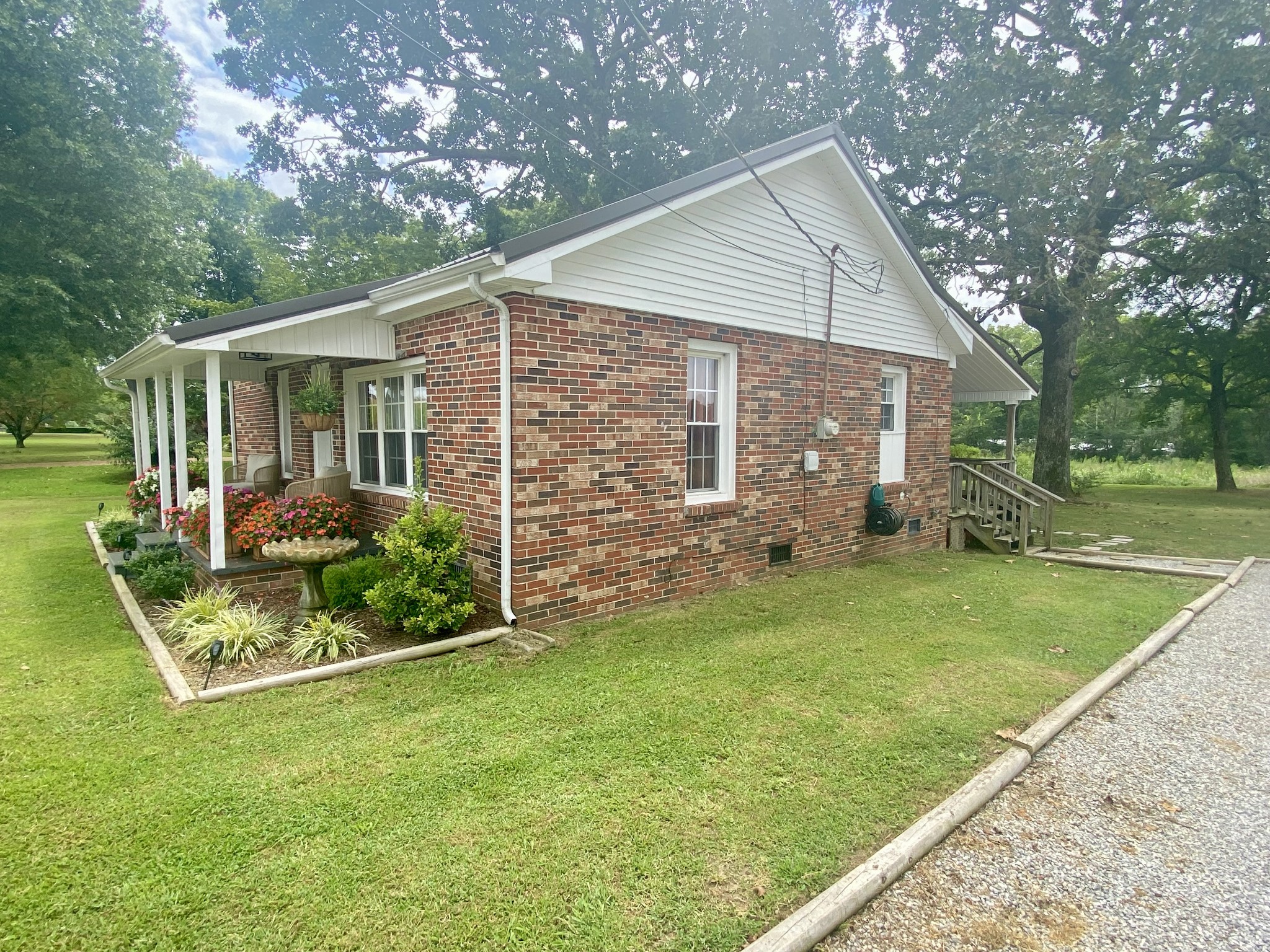 308 Spring Street Loretto, TN 38469 - Photo 4 of 28 a front view of house with garden