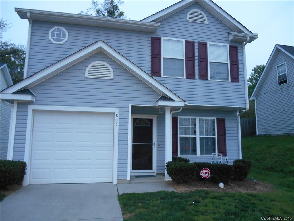 808 Valley Ridge Road Charlotte, NC 28214 - Photo 1 of 19 a front view of a house with a garden