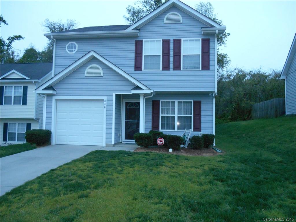 808 Valley Ridge Road Charlotte, NC 28214 - Photo 2 of 19 a front view of a house with a garden and plants