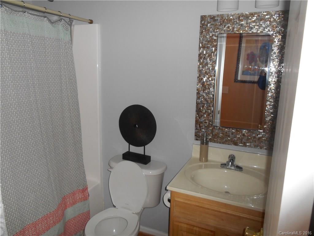 808 Valley Ridge Road Charlotte, NC 28214 - Photo 11 of 19 a bathroom with a sink toilet and shower
