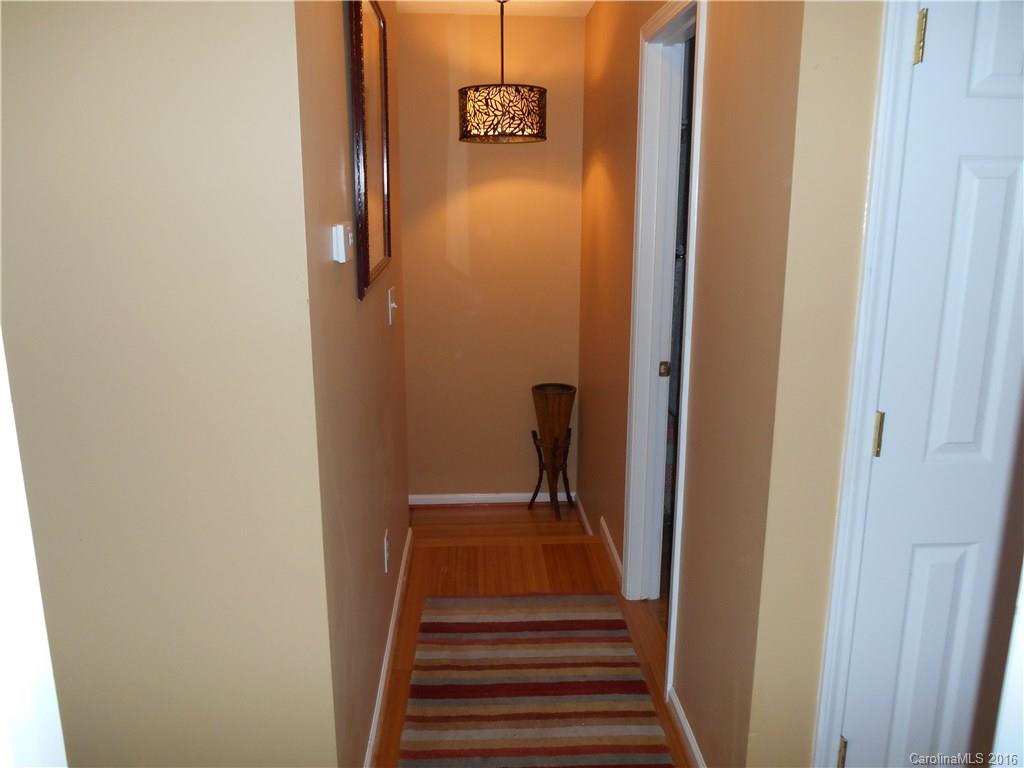 808 Valley Ridge Road Charlotte, NC 28214 - Photo 19 of 19 a view of a hallway with wooden floor