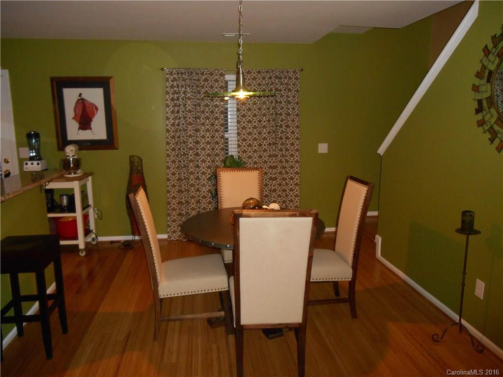 808 Valley Ridge Road Charlotte, NC 28214 - Photo 5 of 19 a view of a dining room with furniture and wooden floor