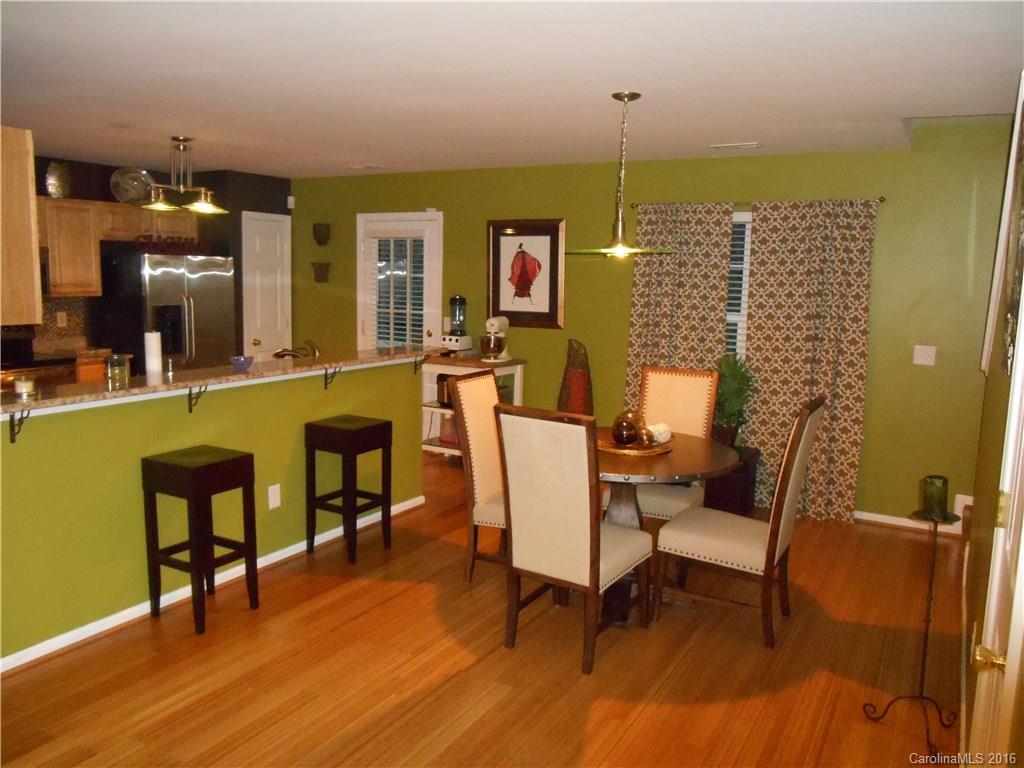 808 Valley Ridge Road Charlotte, NC 28214 - Photo 6 of 19 a living room with furniture and a wooden floor