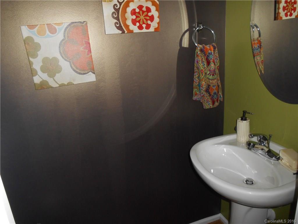 808 Valley Ridge Road Charlotte, NC 28214 - Photo 10 of 19 a bathroom with a sink and a mirror
