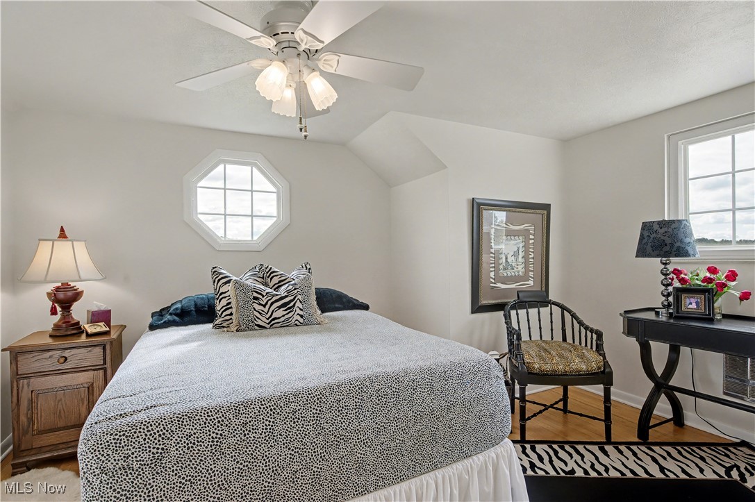 913 Rost Road Walker, WV 26180 - Photo 18 of 48 Bedroom with wood finished floors and ceiling fan