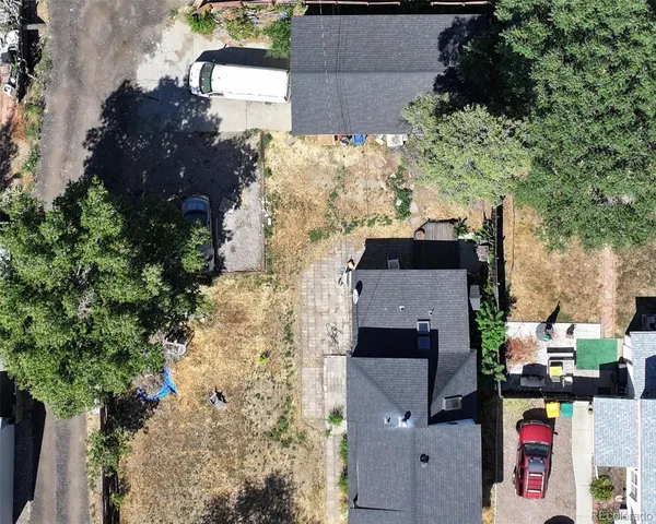an aerial view of houses with outdoor space