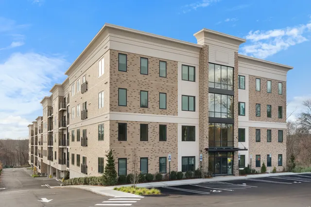 a front view of a building with a street