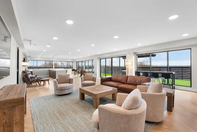 a living room with furniture and a table