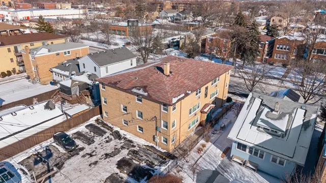 an aerial view of houses with outdoor space