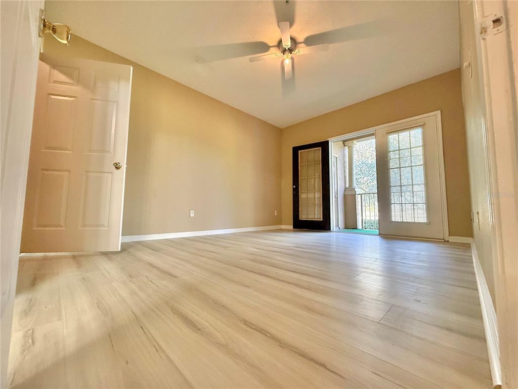 14226 Fredricksburg Drive, Unit 212 Orlando, FL 32837 - Photo 12 of 32 a view of an empty room with glass door