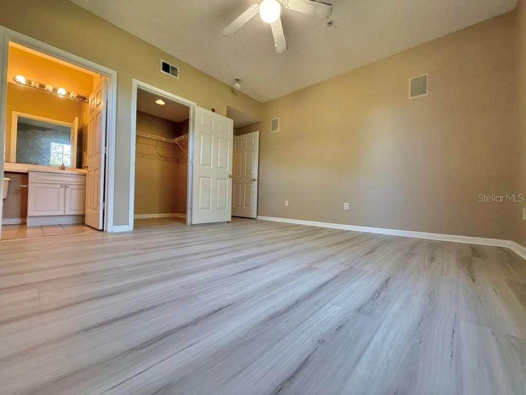14226 Fredricksburg Drive, Unit 212 Orlando, FL 32837 - Photo 18 of 32 a view of an empty room and wooden floor
