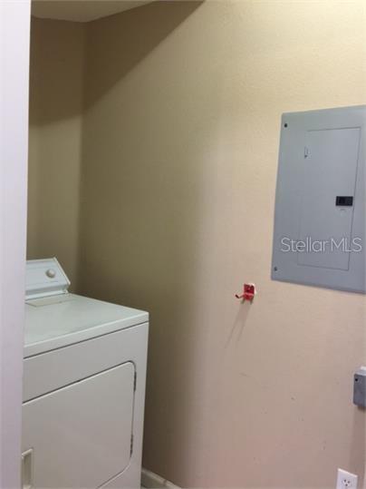 14226 Fredricksburg Drive, Unit 212 Orlando, FL 32837 - Photo 25 of 32 a utility room with dryer and washer