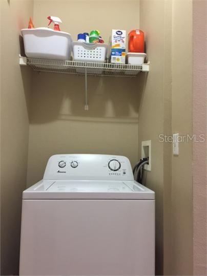 14226 Fredricksburg Drive, Unit 212 Orlando, FL 32837 - Photo 26 of 32 a utility room with washer and dryer
