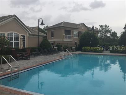 14226 Fredricksburg Drive, Unit 212 Orlando, FL 32837 - Photo 27 of 32 a front view of a house with a yard