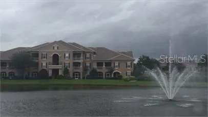 a front view of a house with a garden and yard