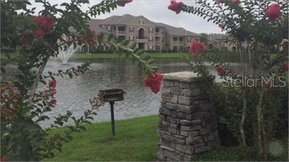 14226 Fredricksburg Drive, Unit 212 Orlando, FL 32837 - Photo 29 of 32 a front view of a house with a garden