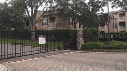 14226 Fredricksburg Drive, Unit 212 Orlando, FL 32837 - Photo 31 of 32 a view of a entrance gate of a house