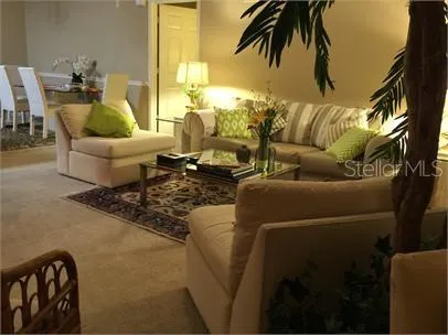 a living room with furniture and a rug