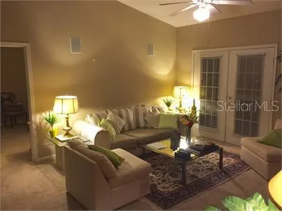 a living room with fireplace furniture and a table