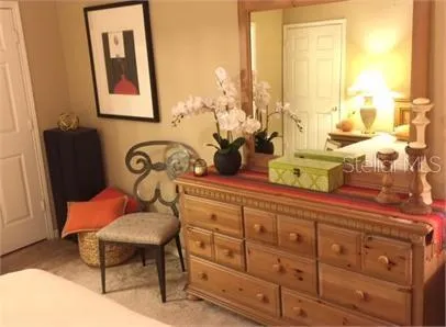 a view of a dining room with furniture and a potted plant