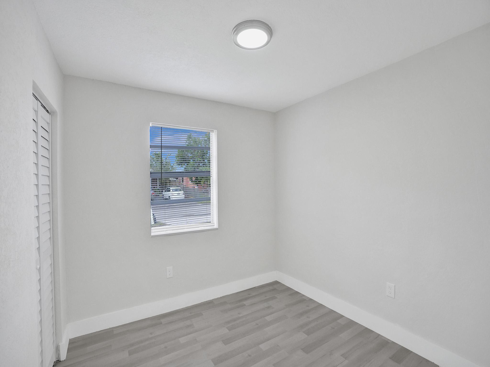 631 North 69th Terrace Hollywood, FL 33024 - Photo 16 of 60 an empty room with a window