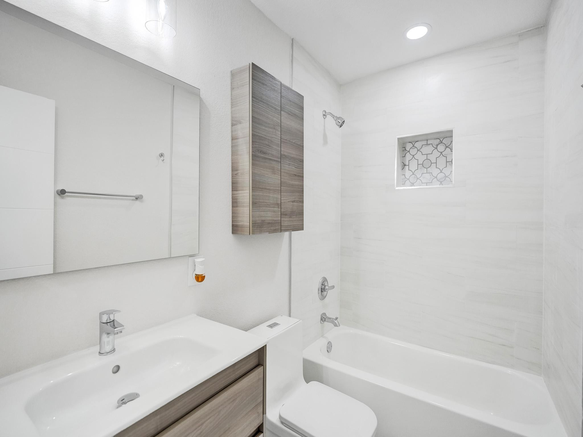 631 North 69th Terrace Hollywood, FL 33024 - Photo 25 of 60 a bathroom with a sink toilet and shower