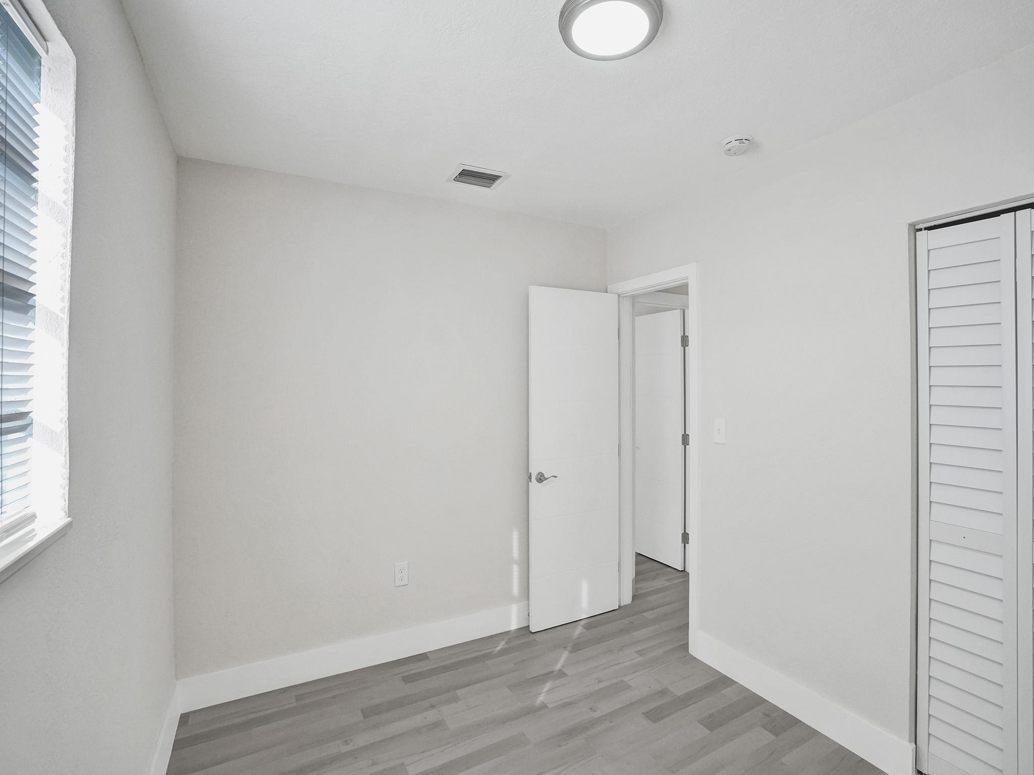 631 North 69th Terrace Hollywood, FL 33024 - Photo 30 of 60 a view of an empty room with wooden floor