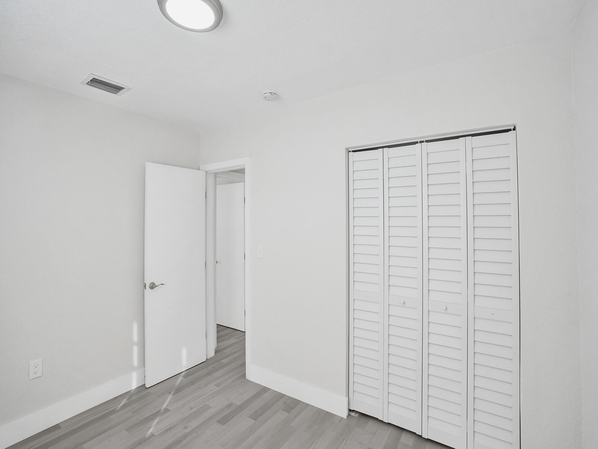 631 North 69th Terrace Hollywood, FL 33024 - Photo 31 of 60 a view of an empty room with wooden floor