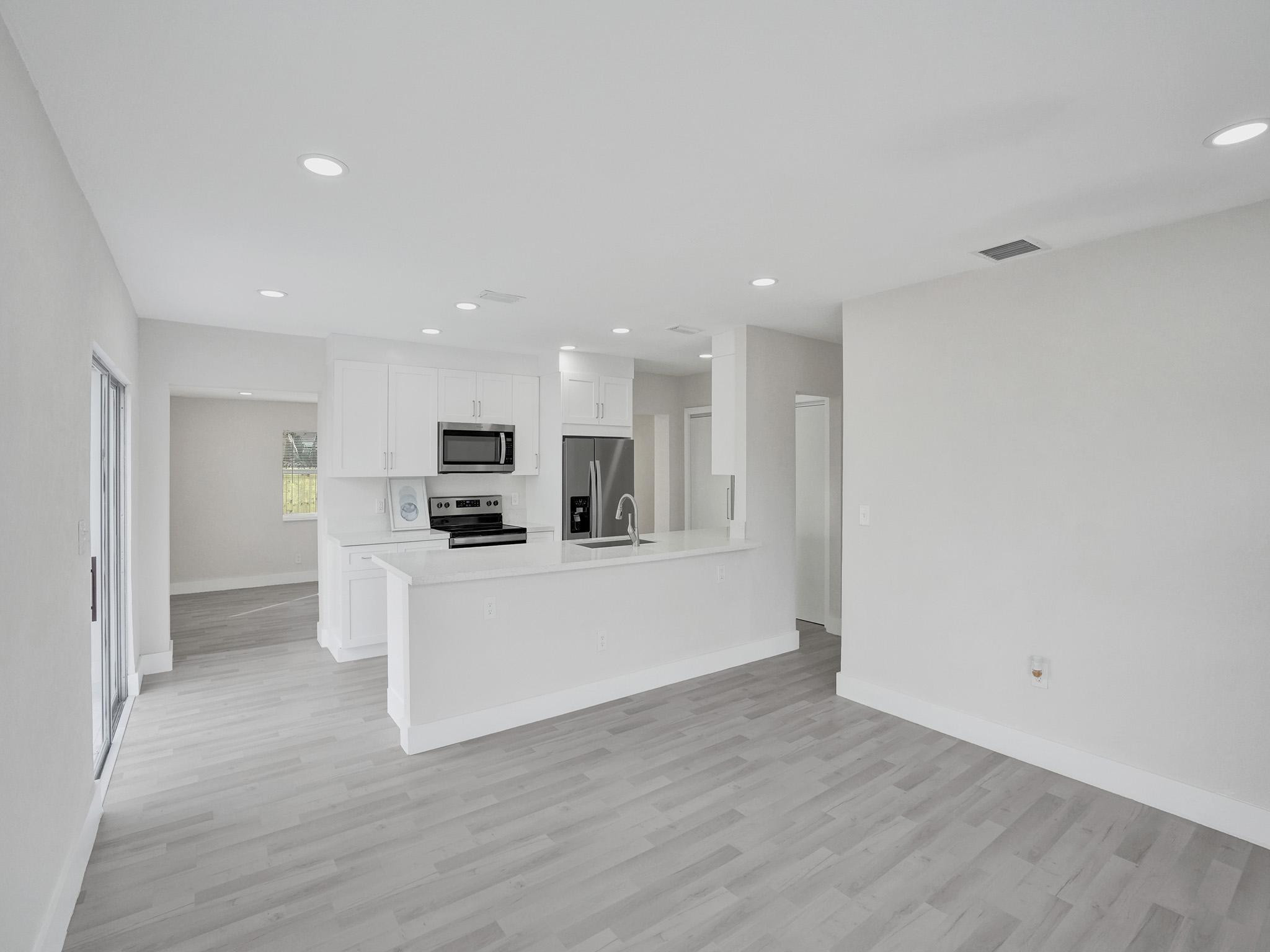 631 North 69th Terrace Hollywood, FL 33024 - Photo 35 of 60 a view of kitchen with wooden floor