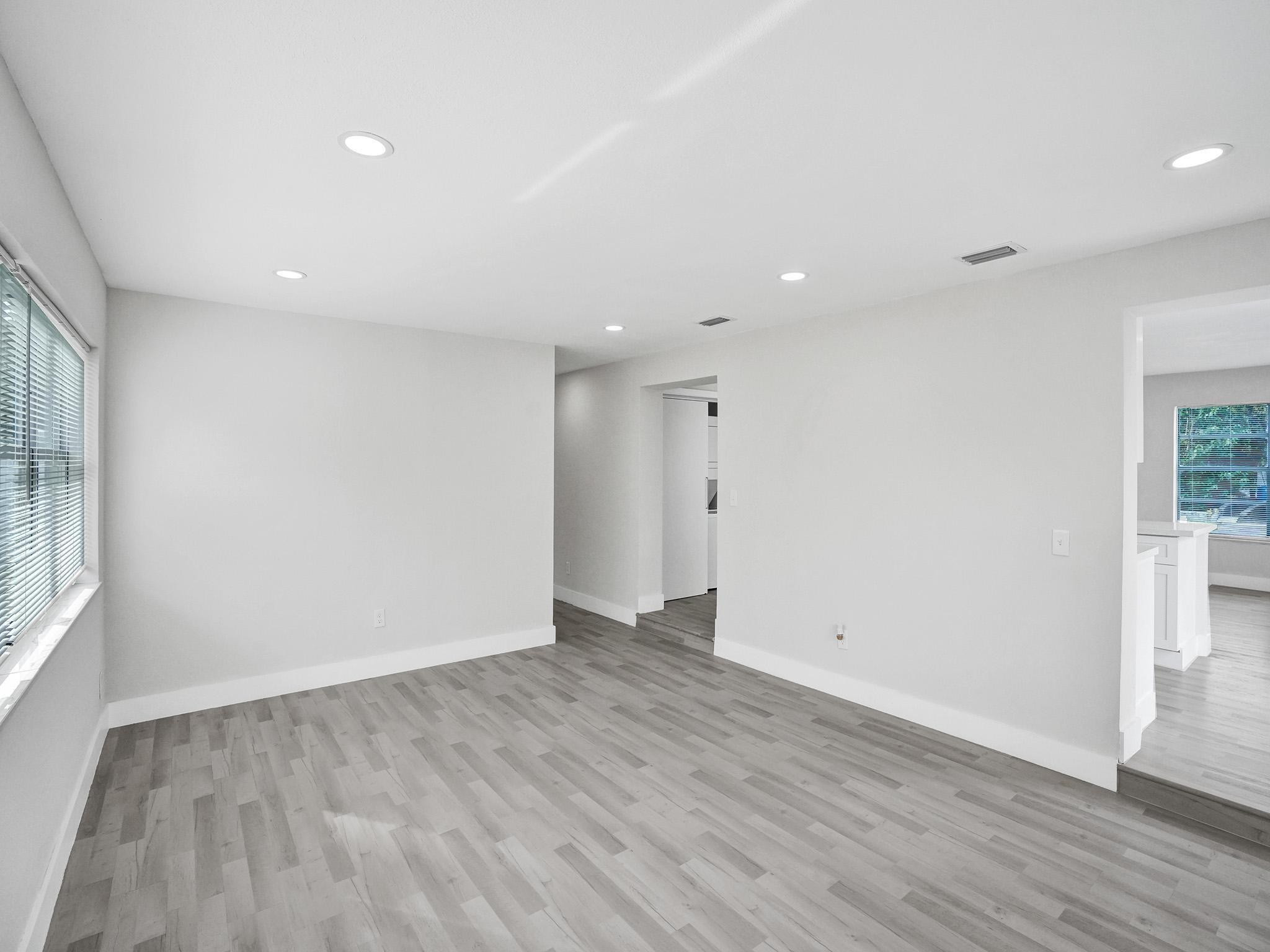 631 North 69th Terrace Hollywood, FL 33024 - Photo 50 of 60 an empty room with wooden floor and windows