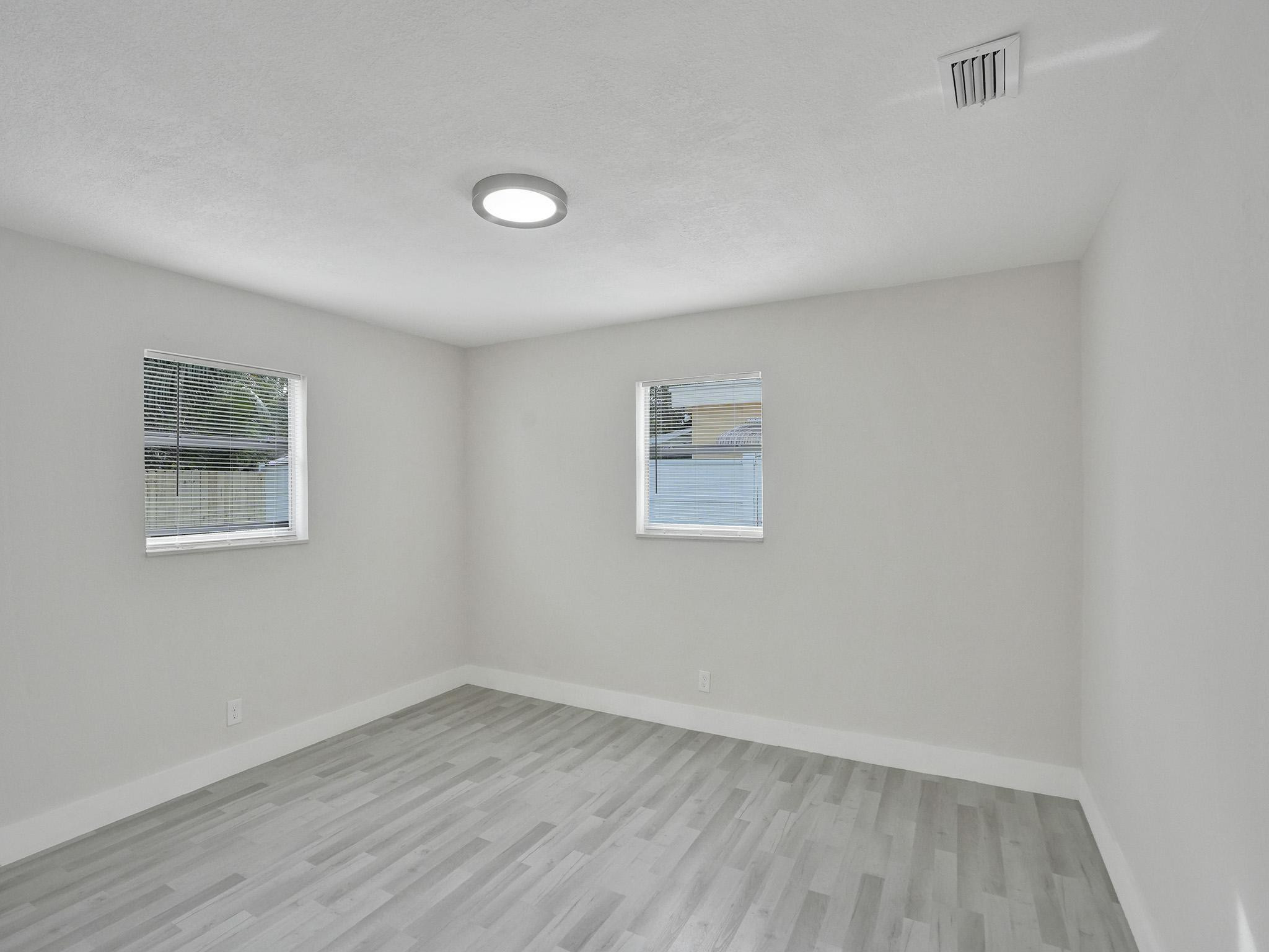 631 North 69th Terrace Hollywood, FL 33024 - Photo 5 of 60 an empty room with a workspace