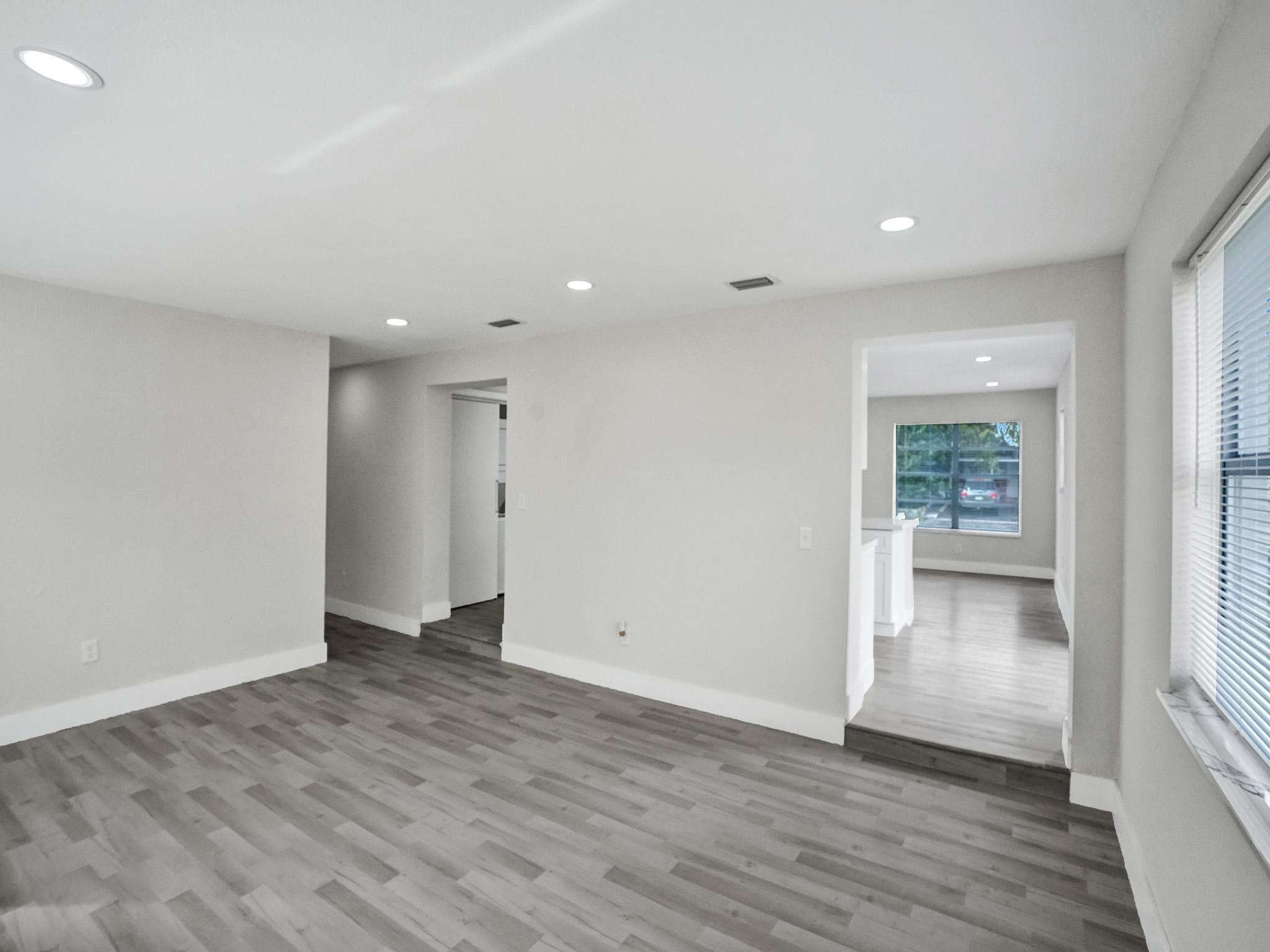 631 North 69th Terrace Hollywood, FL 33024 - Photo 51 of 60 wooden floor in an empty room with a window