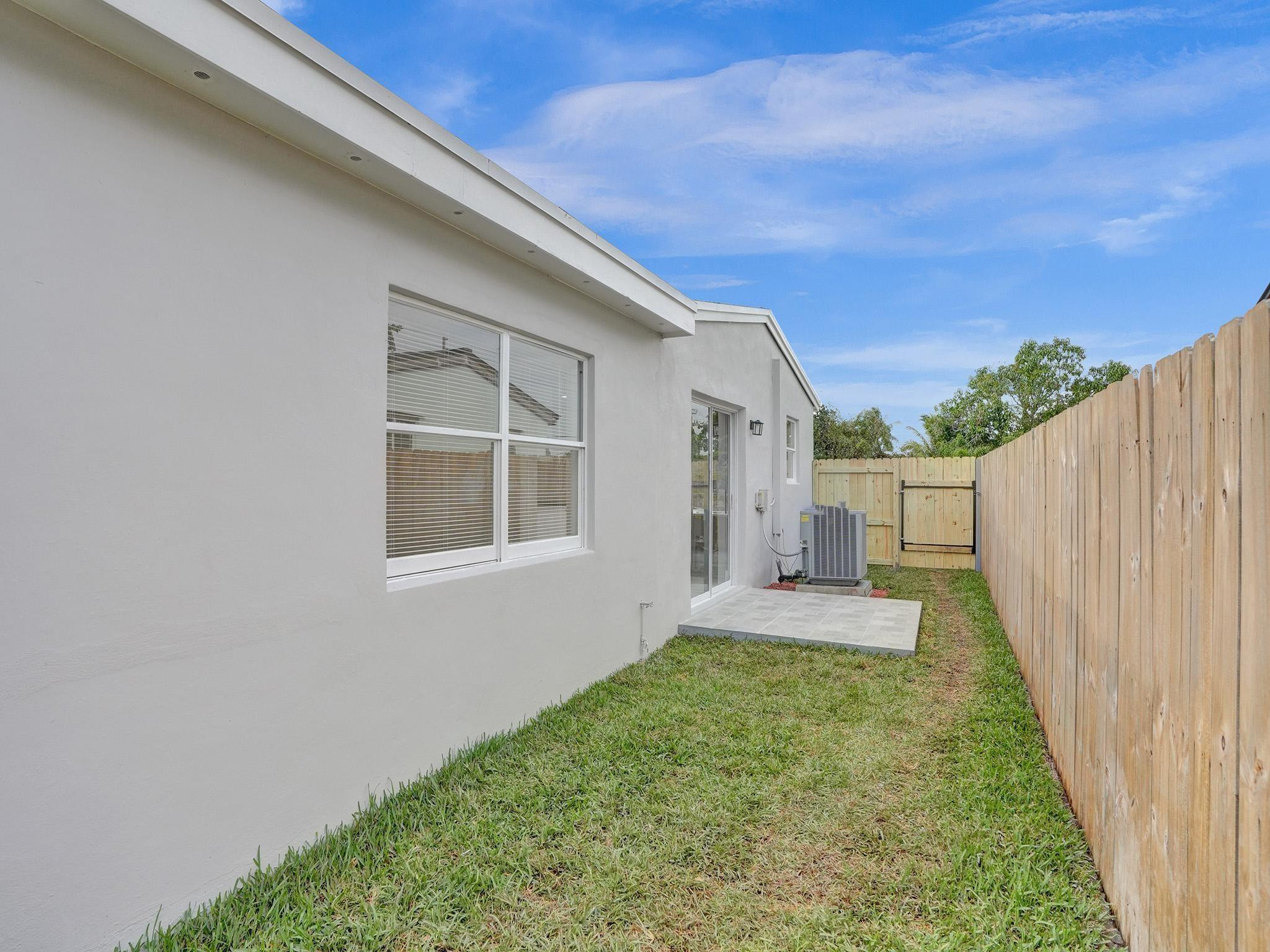 631 North 69th Terrace Hollywood, FL 33024 - Photo 55 of 60 a view of a backyard with wooden fence